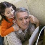 Girl and grandpa reading