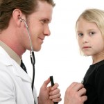 Small child recieving medical. Over white background.